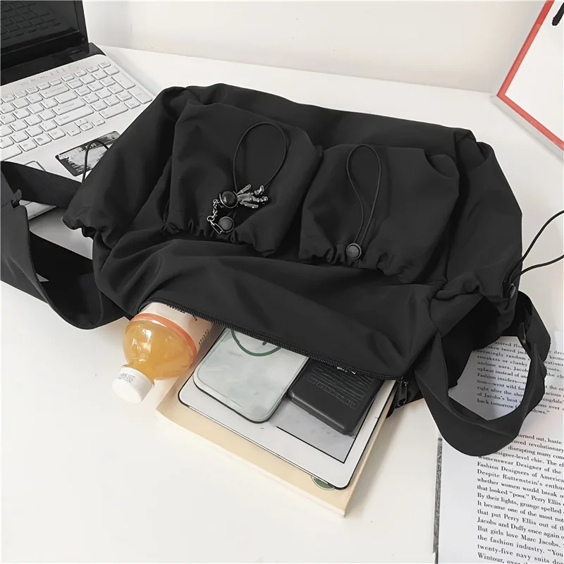 Fashionable Crossbody Bag with Drawstring Accent Spacious Zippered Closure & Stylish Bag Charm