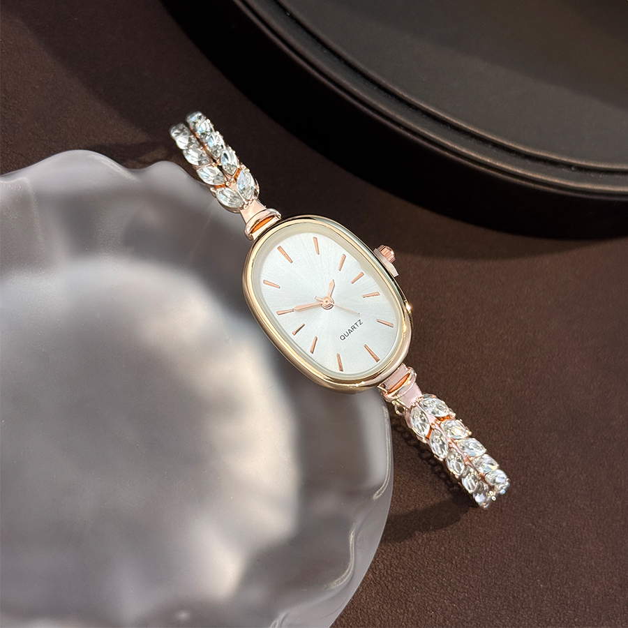 Best-selling Elegant Leaf Embedded Diamond Quartz Watch, New Oval Pull Cord Fashion Bracelet