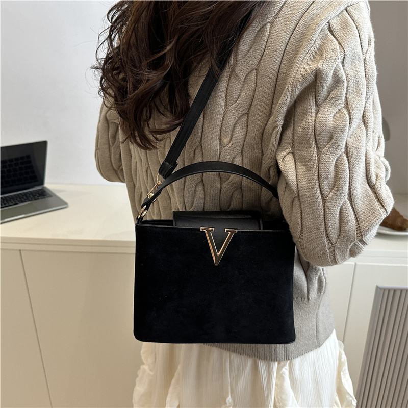Chic Suede Handbag with V Emblem Elegant and Versatile Top Handle Bag