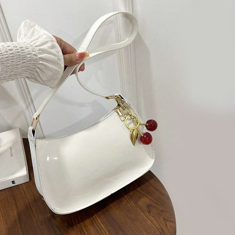 Womens Leather Handbag with Cherry Pendant Versatile Fashion Solid Color Shoulder Bag for Casual Commuting