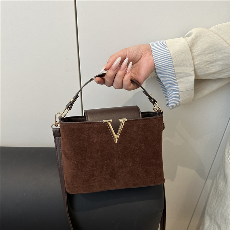 Chic Suede Handbag with V Emblem Elegant and Versatile Top Handle Bag