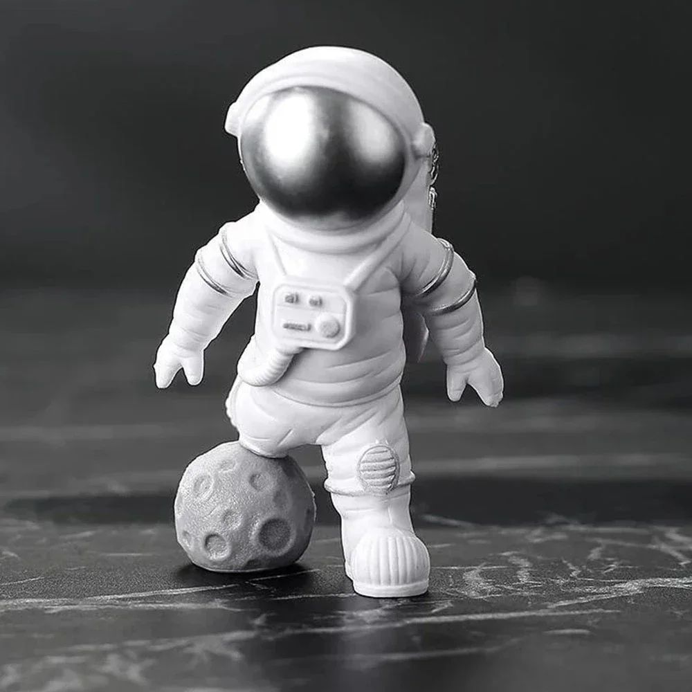 4-Piece astronaut figurine set resin space decor statues for desk, shelf, and kids room