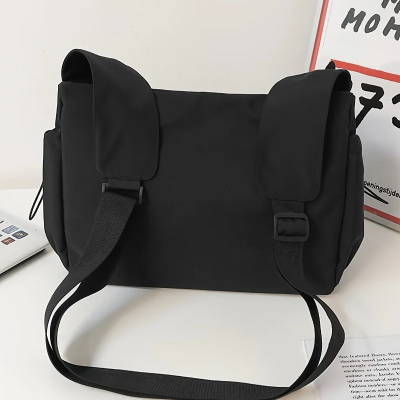Fashionable Crossbody Bag with Drawstring Accent Spacious Zippered Closure & Stylish Bag Charm